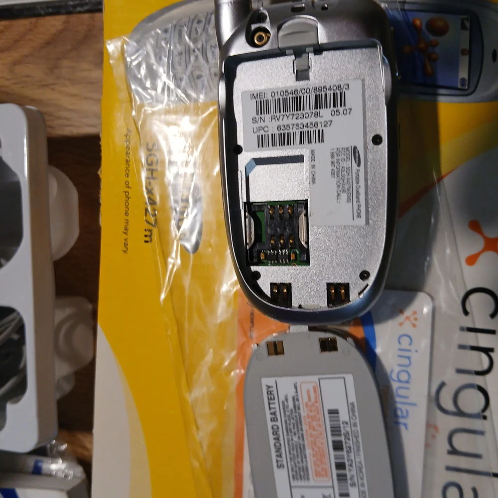 Samsung Silver Flip Phone with Accessories